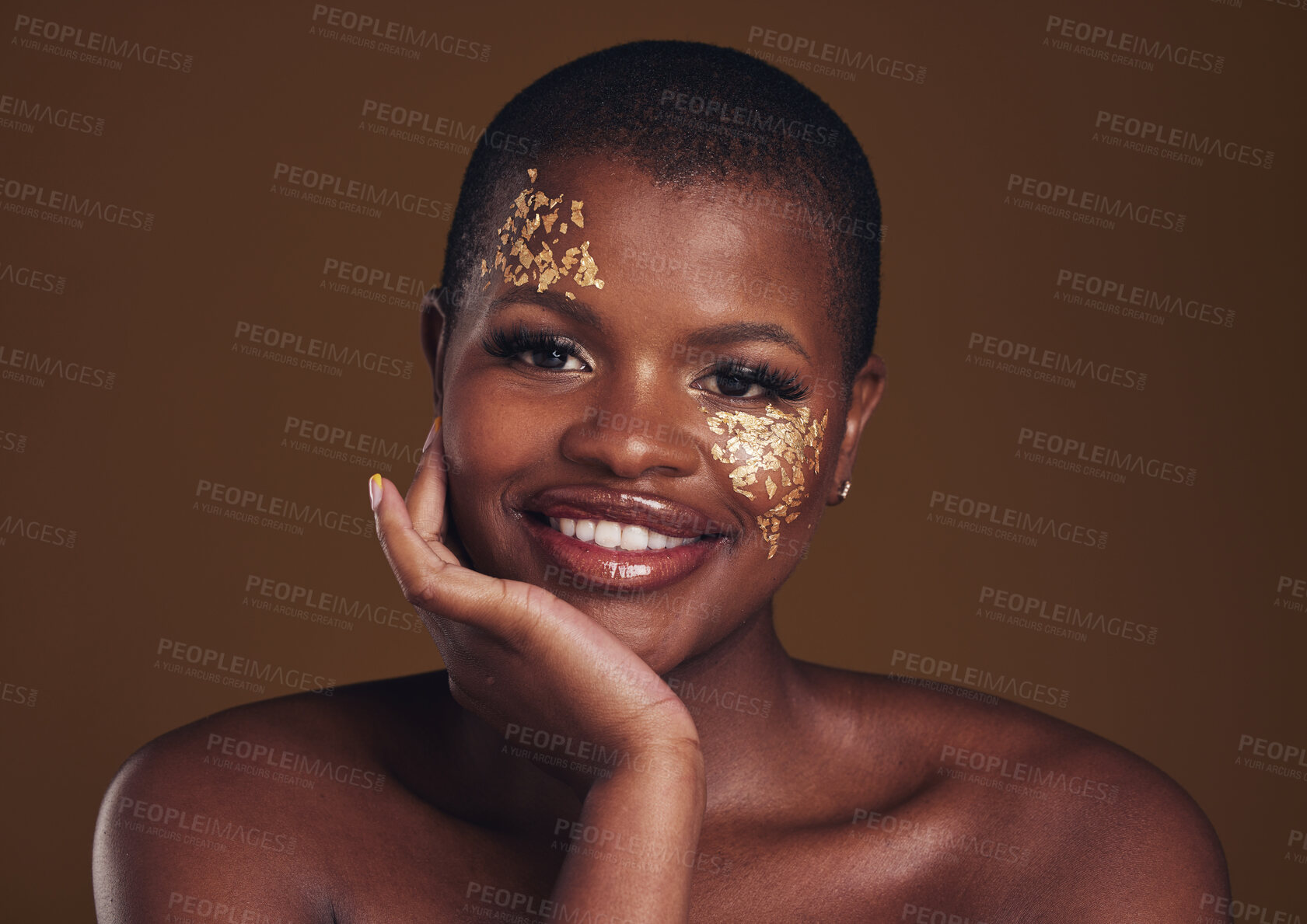 Buy stock photo Gold, glitter portrait and black woman beauty with makeup and skincare mask in studio with sparkle cosmetics. Brown background, funny and model with golden paint for skin glow and creative shine 