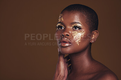 Buy stock photo Art, mockup and black woman with gold makeup on brown background, glitter paint and cosmetics. Shine, glow and African model in studio for beauty, fashion and aesthetic freedom in luxury skincare.