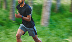 Running, fitness and fast man with blur in forest for marathon training, exercise and cardio workout. Sports, nature and athlete for wellness, healthy body and endurance for race, speed and challenge