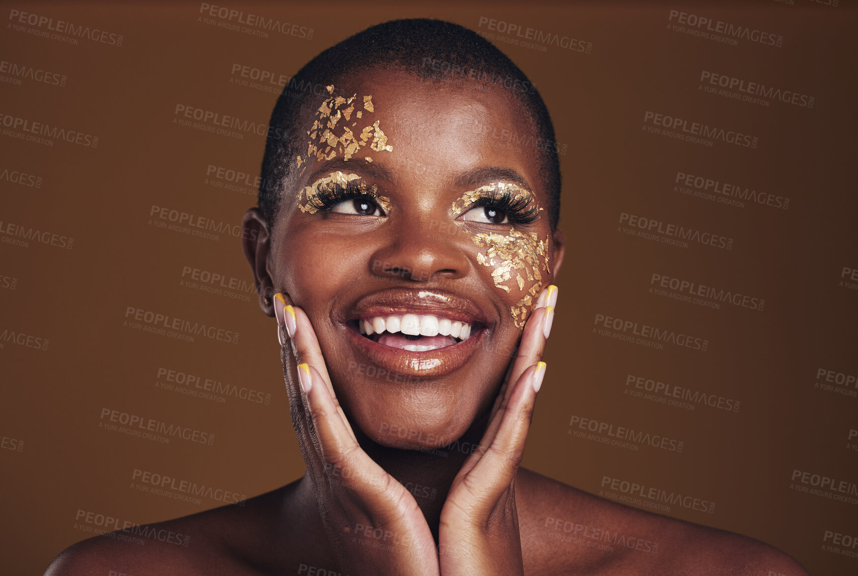 Buy stock photo Gold, glitter face and black woman beauty with makeup and smile in studio with sparkle cosmetics. Brown background and female model with golden paint for skin glow art and creative facial shine 