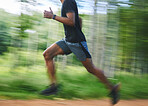 Running, speed and blur of man in forest for marathon training, exercise and cardio workout. Sports, fitness and fast athlete in nature for wellness, healthy body and endurance for race or challenge