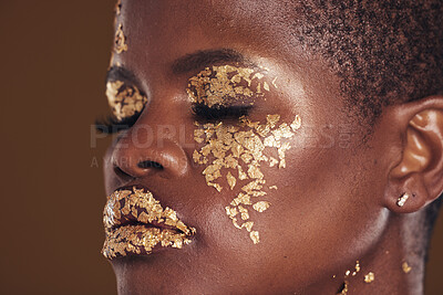 Buy stock photo Gold, beauty and black woman with makeup for aesthetic isolated in a studio brown background eyes closed. Creative, luxury and face of African person with cosmetic glamour or design for skincare