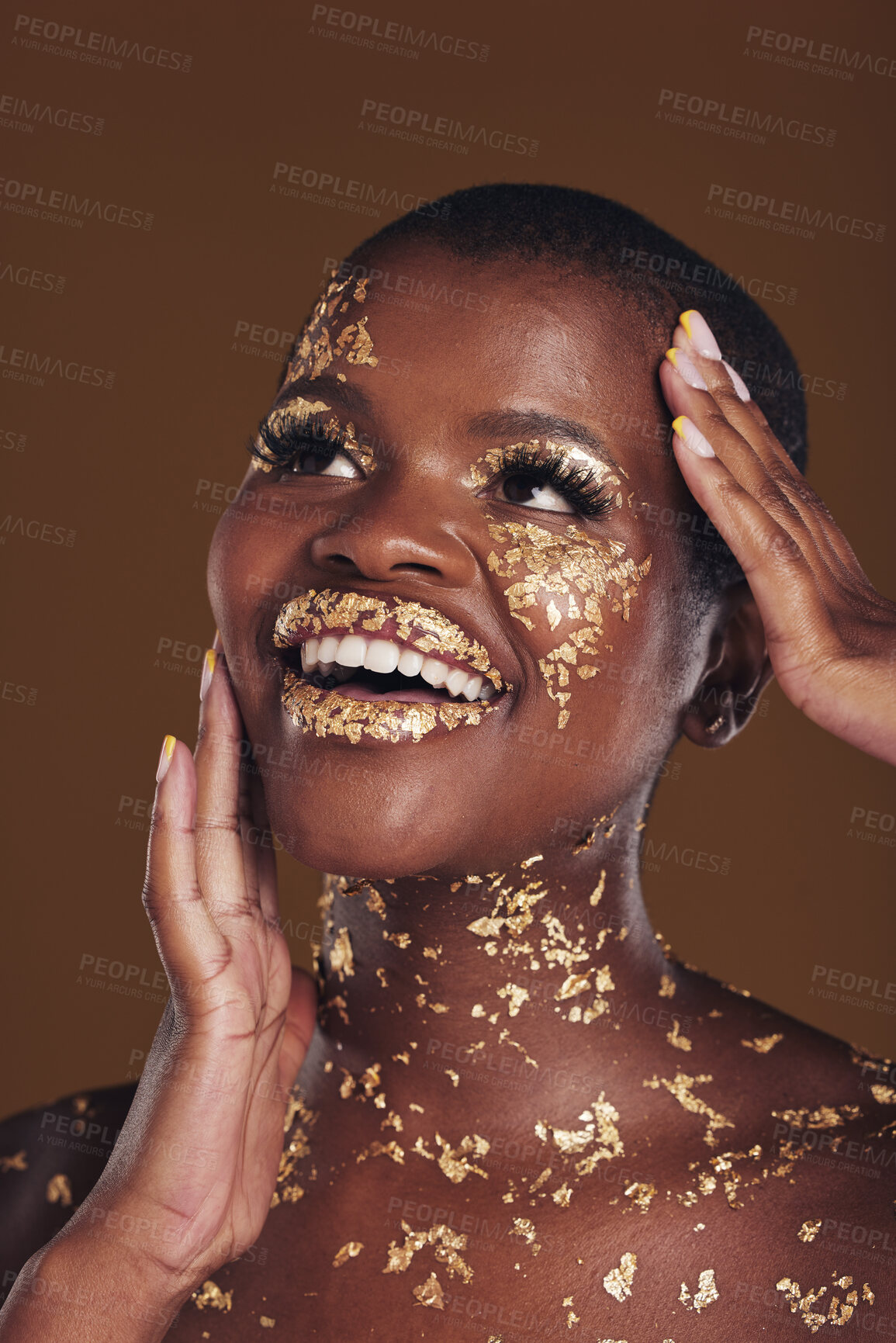 Buy stock photo Gold, glitter flake and black woman beauty with makeup and luxury in studio with sparkle cosmetics. Brown background, smile and female model with golden paint for skin glow and creative facial shine 