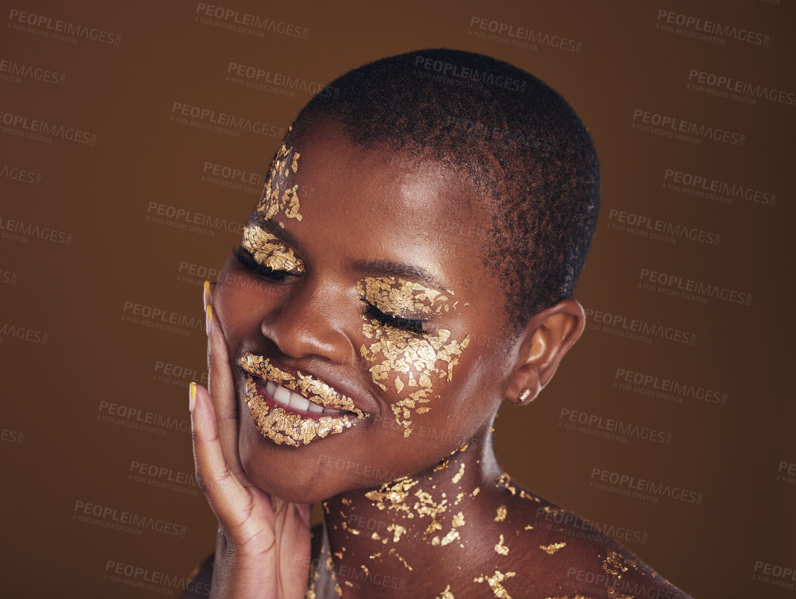 Buy stock photo Black woman, relax and gold makeup with luxury dermatology and skincare mask with glitter. Sparkle, smile and beauty with happy glow and shine of cosmetics and model in a studio with facial art