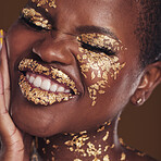 Black woman, face and gold makeup closeup with luxury dermatology and skincare mask with glitter. Sparkle, smile and beauty with rich and shine of cosmetics and model in a studio with facial art
