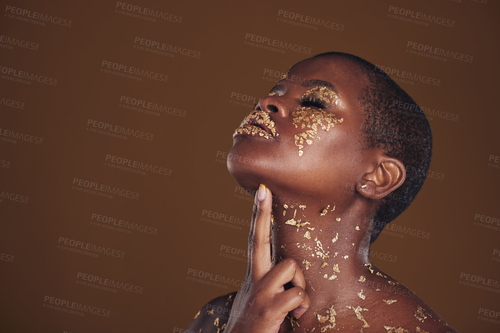 Buy stock photo Profile, beauty and black woman with gold makeup, mockup and brown background with art, glitter paint and cosmetics. Shine, glow and African model in studio space for aesthetic, luxury and skincare.