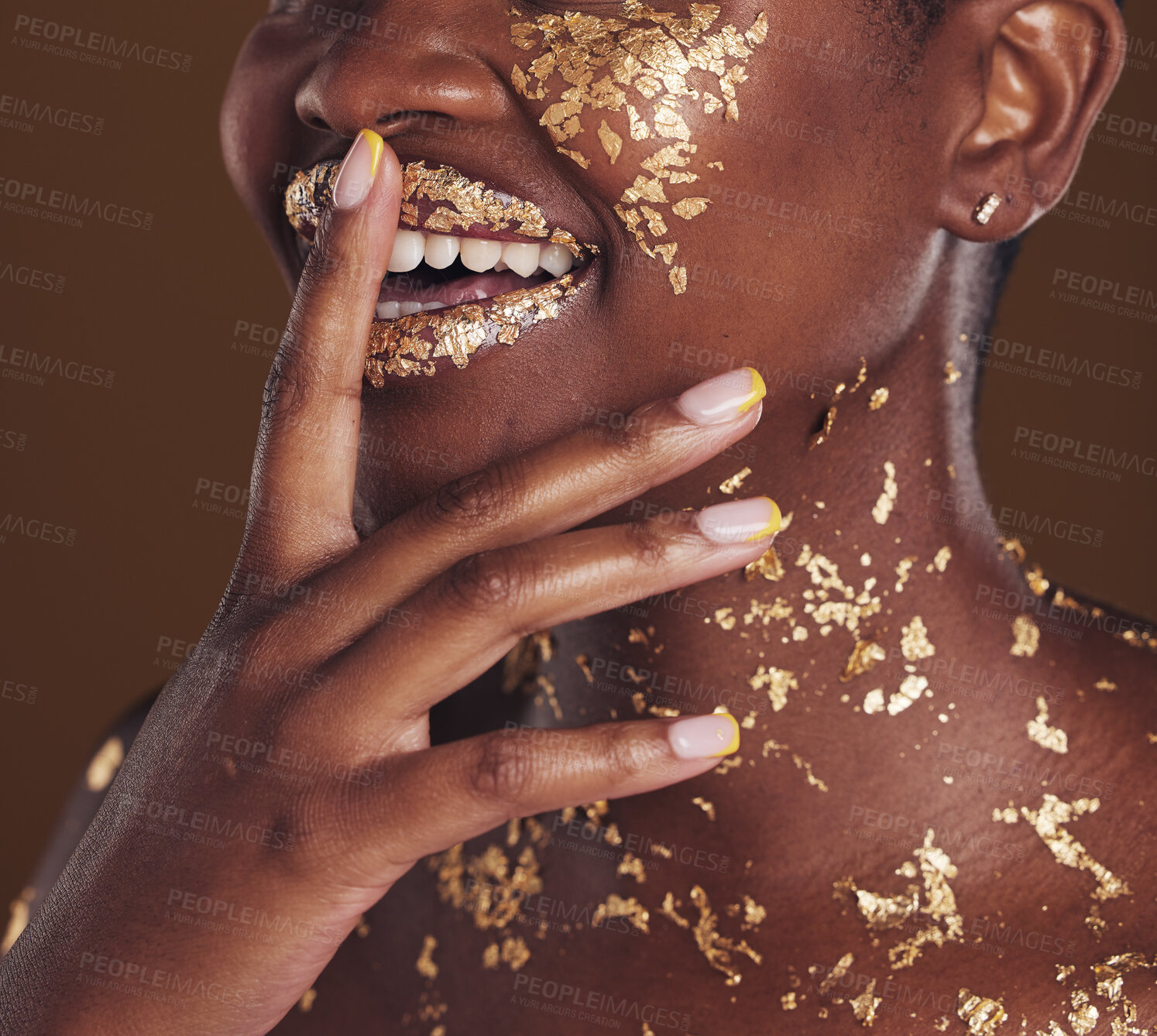 Buy stock photo Gold, smile and woman mouth closeup with makeup and luxury treatment with rich spa mask. Glitter, golden dermatology and African person happy from creative skincare and art cosmetics in studio