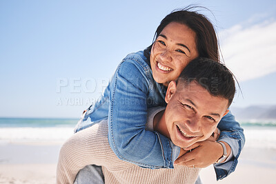 Buy stock photo Happy, piggyback and portrait of a couple at the beach for a date, love or vacation together. Summer, smile and a man and woman with a hug at the sea for a holiday, travel or bonding in marriage