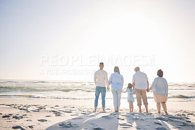 Buy stock photo Summer, space and holding hands with big family on beach for vacation, bonding and love. Freedom, care and relax with group of people walking at seaside holiday for generations, happiness and mockup