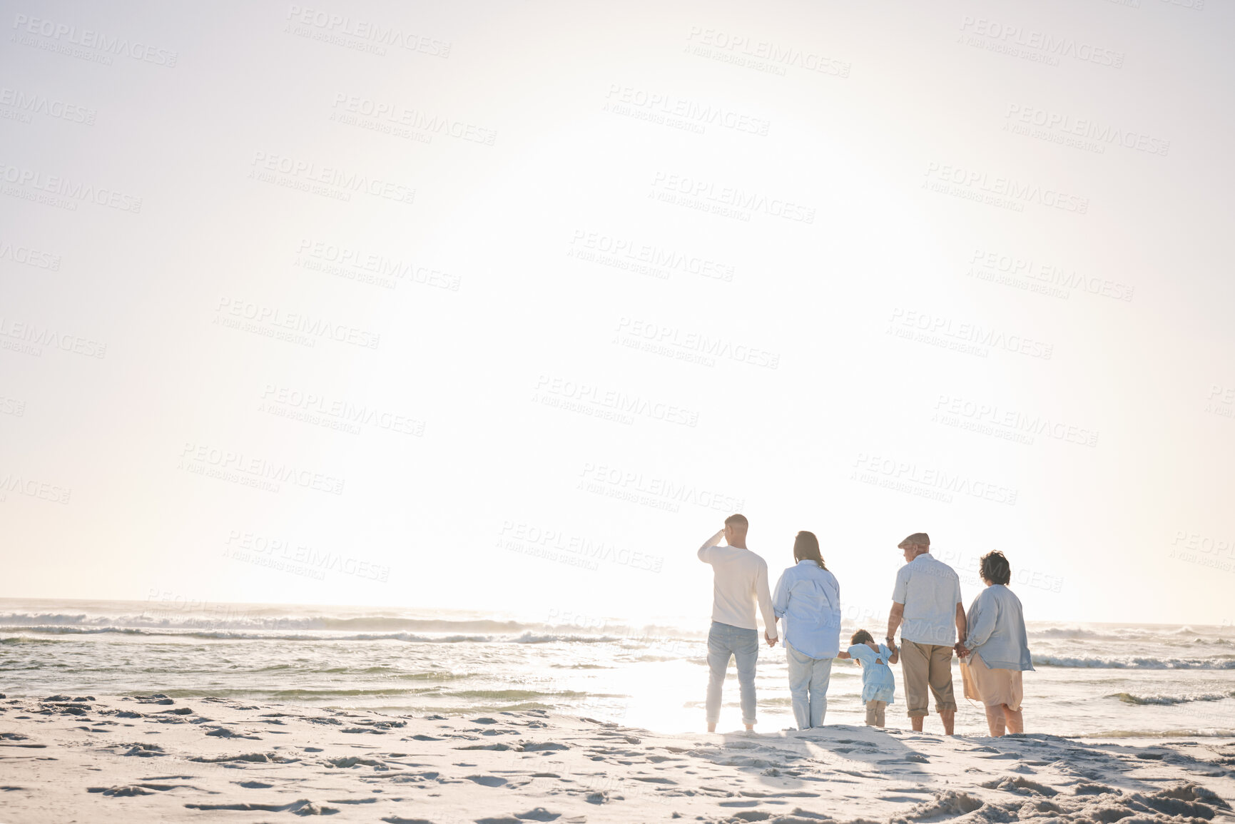 Buy stock photo Space, travel and holding hands with big family on beach for vacation, bonding and love. Summer, care and relax with group of people walking at seaside holiday for generations, happiness and mockup