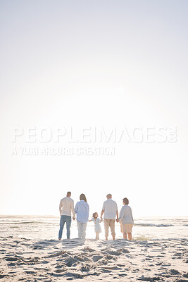 Buy stock photo Love, travel and holding hands with big family on beach for vacation, bonding and summer. Freedom, care and relax with group of people walking at seaside holiday for generations, happiness and mockup