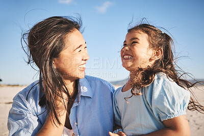 Buy stock photo Laughing, care and a mother and child at the beach for family, travel or summer freedom. Happy, young and a mom with a girl kid at the ocean for a holiday, bonding or together with love at the sea