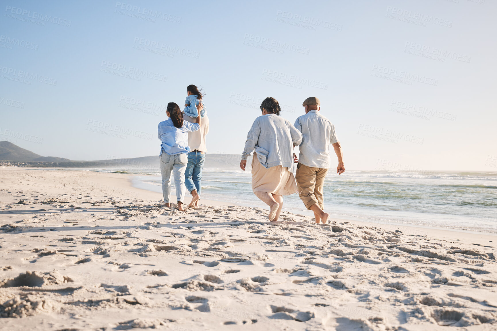 Buy stock photo Beach, walking and family back on vacation with bonding, love and care. Summer, mom and travel with parents, grandparents and kids together by the ocean water and sea freedom on a holiday trip