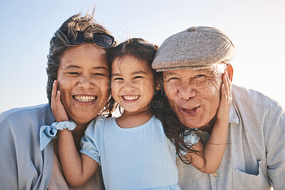 Buy stock photo Smile, sky and portrait of a girl with her grandparents in nature on a family vacation or holiday. Happy, love and child holding her grandmother and grandfather with care on an outdoor weekend trip.