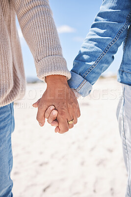 Buy stock photo Beach, closeup and couple holding hands for love, commitment and marriage in nature. Travel, bonding and man and woman together by ocean for care, trust and affection on holiday, vacation and weekend