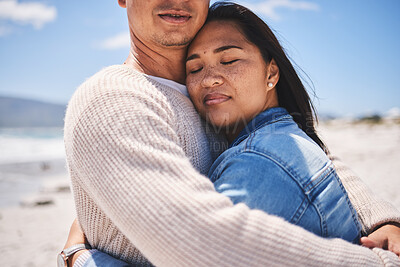 Buy stock photo Love, hug and relax with couple at beach for travel, summer vacation and romance together. Calm, embrace and bonding with man and woman walking on seaside holiday for care, date or honeymoon