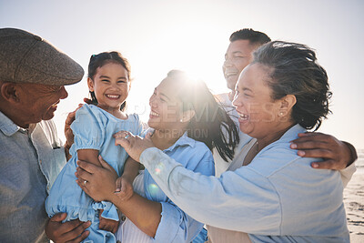 Buy stock photo Family, smile and a girl on the beach with her grandparents in summer for holiday or vacation together. Love, sunset or flare with parents, kids and senior people by the ocean or sea for bonding