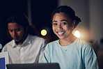 Overtime, portrait and happy woman in office with laptop, teamwork and typing email, report or review. Night, computer and business people in workplace with smile, online schedule planning and bokeh.
