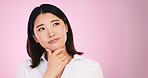 Asian woman, thinking and decision on mockup space in problem solving against a pink studio background. Female person with idea, solution or choice in memory, reminder or  brainstorming on mock up