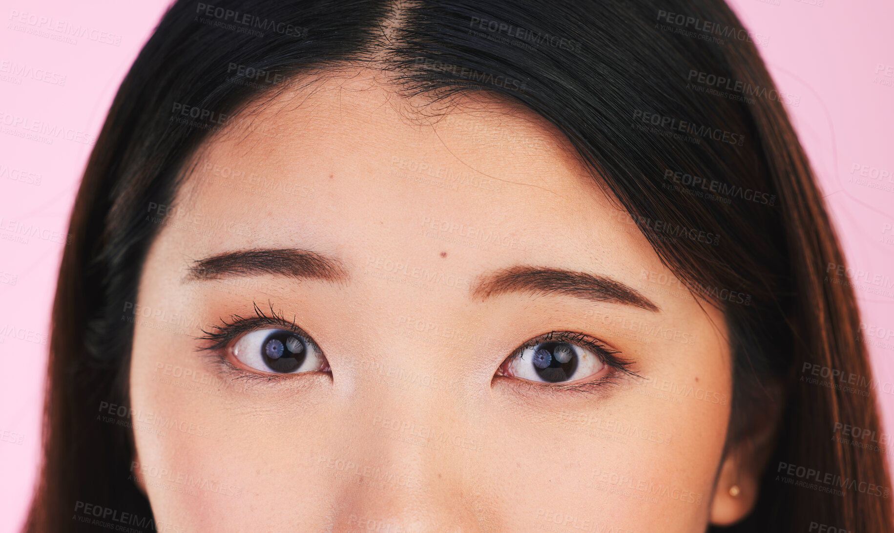 Buy stock photo Closeup, eyes and portrait of an Asian woman on a pink background for makeup or microblading. Face, skincare and a girl or model isolated on a backdrop for facial cosmetics, foundation or eyeliner