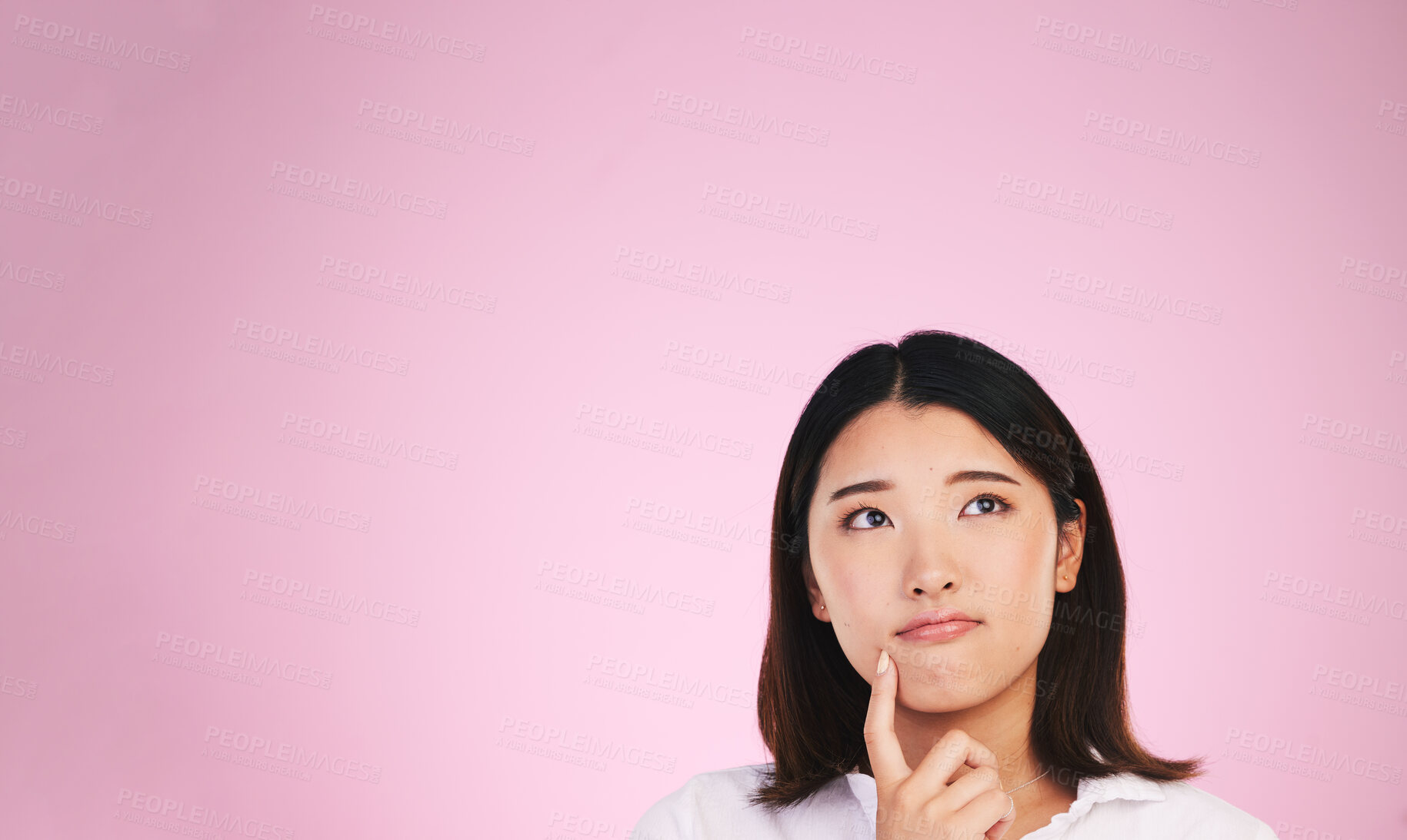 Buy stock photo Asian woman, thinking and mockup space in solution, memory or ideas against a pink studio background. Female person in problem solving, reminder or plan emoji in decision or brainstorming on mock up