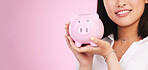 Woman, piggy bank and mockup space in savings, investment or financial growth against a pink studio background. Female person, banner and hands holding piggybank in finance or profit on mock up