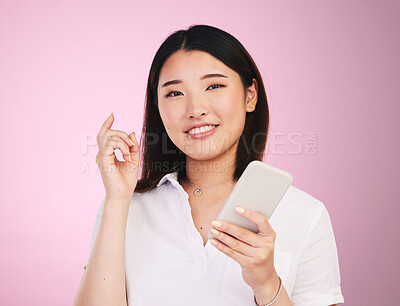 Buy stock photo Search, phone and social media with portrait of woman in studio for networking, communication and internet. Website, post and gen z with Asian person on pink background for technology and mobile app