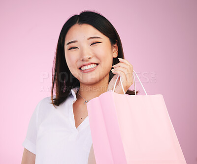 Buy stock photo Woman, shopping bag and retail, customer in portrait with purchase and smile isolated on pink background. Gift, store or boutique discount with fashion, commerce and happy, market and sale in studio