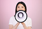 Megaphone announcement, portrait and Asian woman with retail sales discount, promotion deal or broadcast news. Speech, studio or Japanese speaker noise, attention and voice opinion on pink background