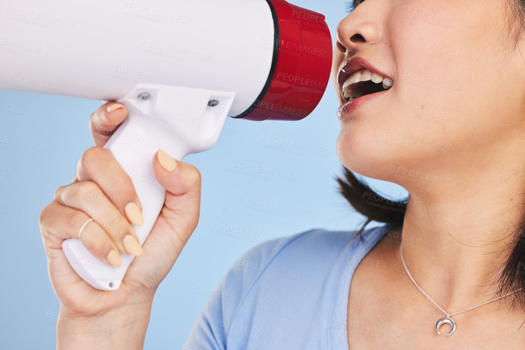Buy stock photo Woman, megaphone and shout for protest, closeup and studio for freedom, justice or peace by blue background. Girl, student activist and loudspeaker for speech, presentation or human rights with audio