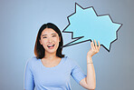 Speech bubble, woman voice and student presentation, chat or communication for college opportunity or forum. Portrait of asian person with opinion, feedback or mockup poster on blue studio background