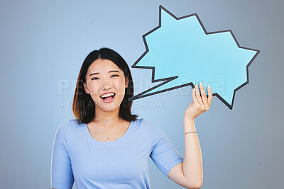 Buy stock photo Speech bubble, woman voice and student presentation, chat or communication for college opportunity or forum. Portrait of asian person with opinion, feedback or mockup poster on blue studio background