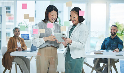 Buy stock photo Business women, tablet and teamwork on glass board for marketing, project planning and happy ideas in meeting. Professional people for digital, sticky notes and scrum or agile presentation in office