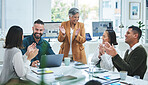Happy business people in meeting at desk with applause, cheers and celebration of sales target achievement. Clapping, praise and congratulations with success, motivation for men and women in office.