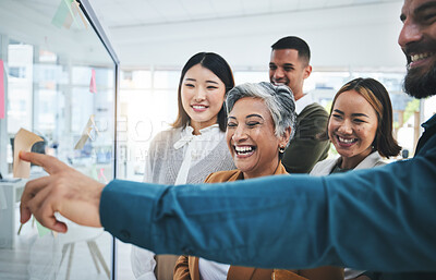 Buy stock photo Happy, writing and staff at glass board for creative marketing with sticky notes and pointing. Calendar planning, content creator schedule and management staff laughing in a business meeting teamwork