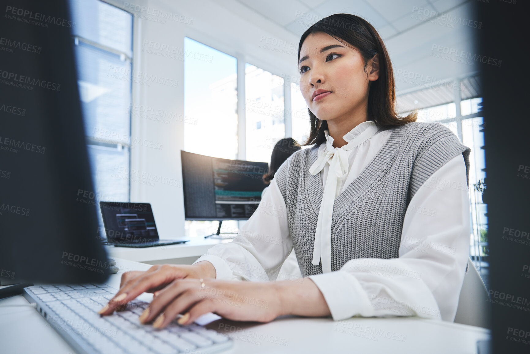 Buy stock photo Asian woman, computer and coding in software development or web design at the office. Female person or employee typing on desktop PC in programming, innovation or problem solving at the workplace