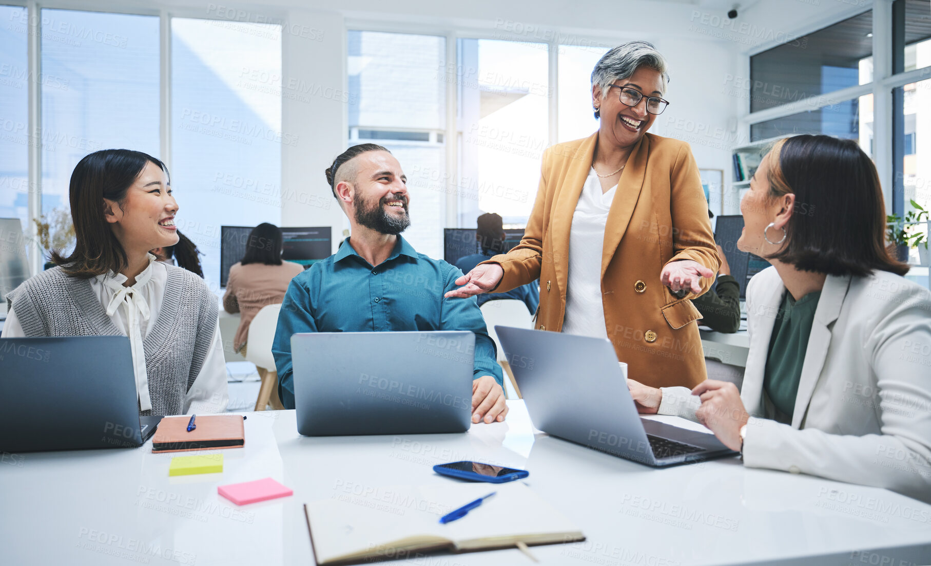 Buy stock photo Happy people, laptop and meeting, marketing team at digital agency, creative group and research online. Man, women and diversity, productivity and business with senior leader and branding strategy