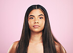 Portrait, shampoo and hair with a woman on a pink background in studio for keratin treatment. Face, skincare or haircare with a confident young model at the salon for natural beauty or cosmetics