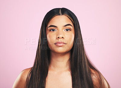 Buy stock photo Portrait, shampoo and hair with a woman on a pink background in studio for keratin treatment. Face, skincare or haircare with a confident young model at the salon for natural beauty or cosmetics