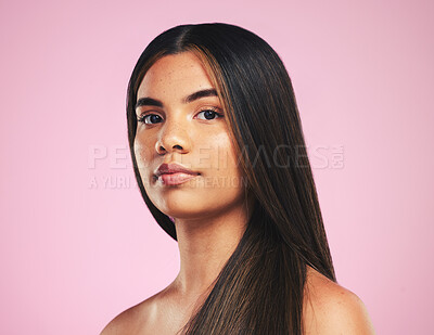 Buy stock photo Portrait, beauty and hair with a woman on a pink background in studio for shampoo treatment. Face, skincare or haircare with a confident young model at the salon for natural or keratin cosmetics