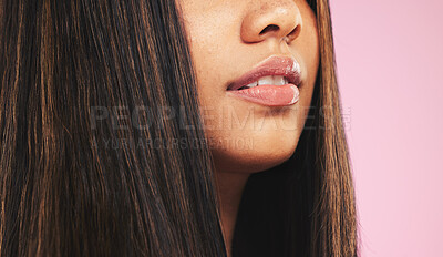 Buy stock photo Beauty, mouth and woman closeup with skincare, lip filler and hair care in a studio. Cosmetics, pink background and female model with facial, lips and skin glow from dermatology and salon treatment