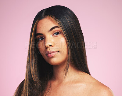 Buy stock photo Portrait, hair care and woman with cosmetics, growth and skincare on a pink studio background. Face, person or model with natural beauty, aesthetic and dermatology with wellness and salon treatment