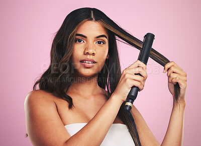 Buy stock photo Portrait, woman and hair care with iron for studio beauty, cosmetic treatment or shine on pink background. Face of model, hairstyle or heating equipment of electric tools for smooth aesthetic texture