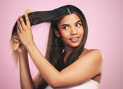 Buy stock photo Woman, hair and care with brush in studio for healthy texture, shine and keratin on pink background. Natural beauty, face and model with comb tools for clean aesthetic hairstyle with growth shampoo