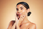 Thinking, skincare or woman with cosmetics, dermatology and wellness on a brown studio background. Person, idea or model with self care, luxury or healthy skin with makeup, hygiene or salon treatment