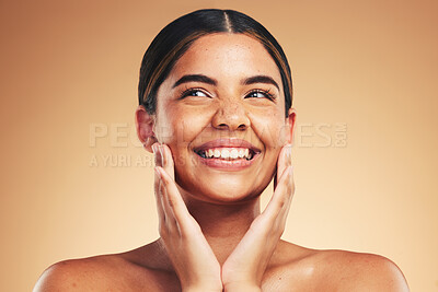 Buy stock photo Skincare, happy and hands on natural woman face in studio for cosmetic, wellness or dermatology on brown background. Beauty, smile and model excited for glowing skin, results or self love cosmetology