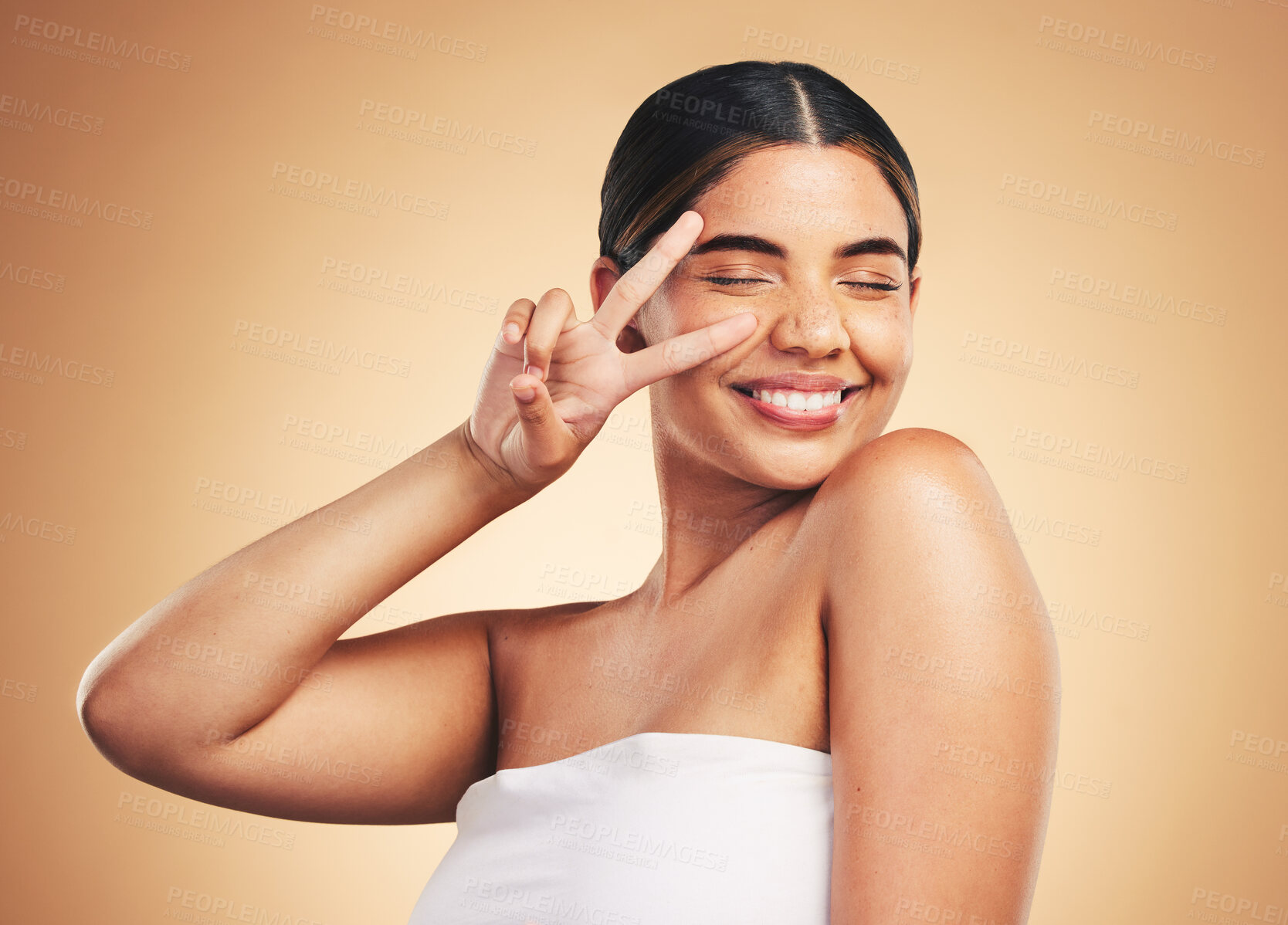 Buy stock photo Woman, beauty and skincare with peace sign, studio and cosmetics with natural glow on face by background. Girl, model and happy with icon, emoji or facial change with melasma, healthy shine and clean