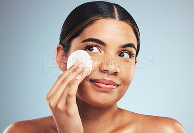 Buy stock photo Woman, cotton pad and skincare for face cosmetics, aesthetic spa and thinking on studio background. Happy young model, beauty and facial dermatology product for cleaning makeup, shine and cosmetology