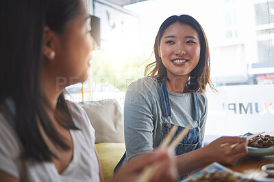 Buy stock photo Restaurant, girl friends and lunch with food, noodles and cafe happy from bonding. Asian women, eating and plate together with friendship smile at a table hungry with chopsticks at Japanese bar