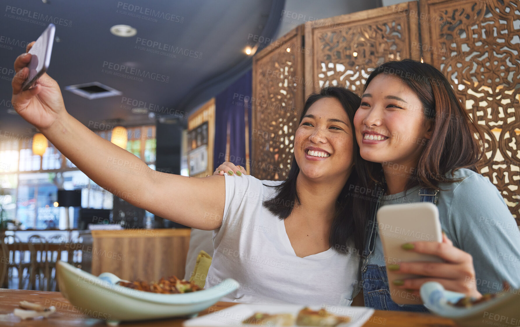 Buy stock photo Selfie, lgbt and a gay couple in an asian restaurant for a romantic date together on an anniversary. Lesbian, smile and happy asian woman with her partner in a cafe for eating or celebration of love